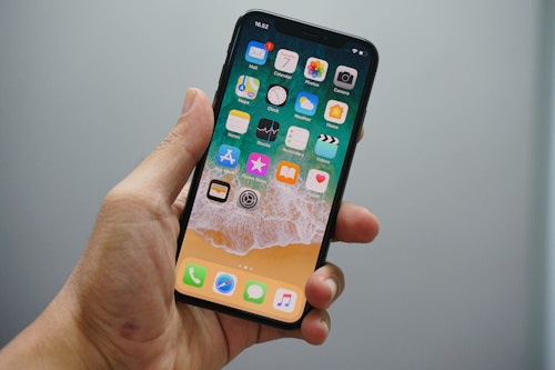 hand holding an iPhone XR
