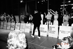 An organiser of the event getting applause by models on the stage