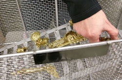 A worker from Maison Vervloet assembling a doorknob