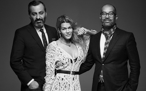 The partners of Milk Studios dressed-up standing next to each other